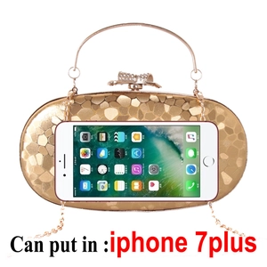 Detail showing internal capacity of the gold clutch bag with an iPhone 7 Plus reference