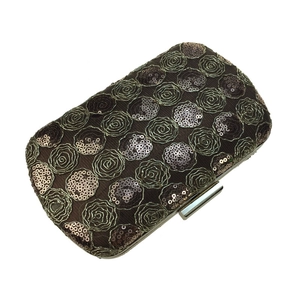 Detail of coffee brown evening clutch featuring rose sequin embroidery and metal frame