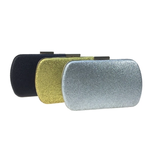 Glittering clutch bags in black, gold, and silver colors with metallic clasp closure