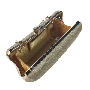 Golden sequin evening clutch interior showing space for smartphone and lipstick