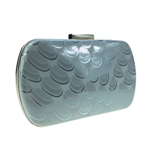 Macro detail of light blue peacock pattern leather evening bag with golden metal frame