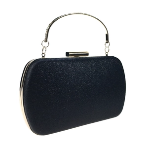Detail of black glitter evening clutch with elegant gold handle and push-lock closure