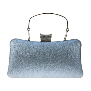 Detail of silver-blue gradient sequins and rhinestone encrusted buckle on evening clutch