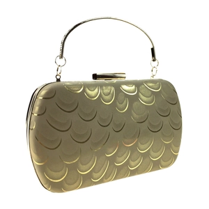 Close-up of champagne gold evening clutch featuring detailed metal fish scale textures