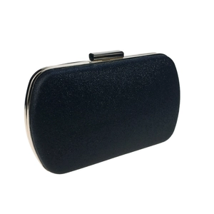 Macro shot of glitter evening clutch with silver metal frame and navy sparkle finish