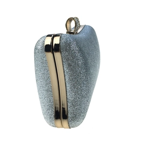 Silver glitter evening clutch bag with gold metal frame and ring clasp detail