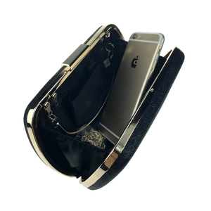 Sparkling black glitter evening clutch with gold metal frame and detachable chain strap
