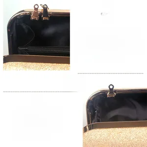 Detail of evening bag showing dual metal hanging loops for handles and chains