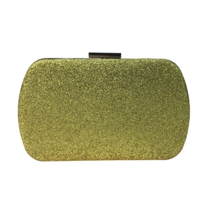 Detailed view of shimmering sequins and rectangular metal clasp on a luxury evening clutch bag