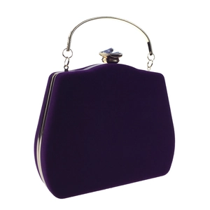 Detailed view of purple velvet evening bag with gold ring handle and crystal clasp