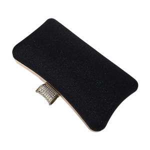 Close-up of black glitter evening clutch with rhinestone encrusted gold metal clasp