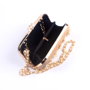 Golden glitter evening clutch with pearl chain strap and open interior view