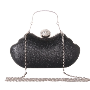 Sparkly black evening clutch bag with wave design, silver handle and rhinestone clasp