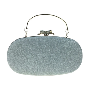 Silver sequin oval evening clutch bag with rhinestone bow clasp and metal handle