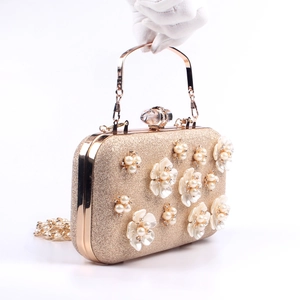 Elegant gold pearl flower evening clutch bag with sequins and metallic handle