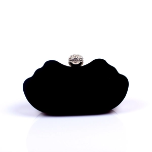 Detail of red-lip shaped black velvet evening clutch with sparkling rhinestone ball clasp