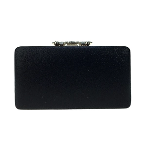 Detailed close-up of a black glitter evening clutch with ornate silver rhinestone clasp