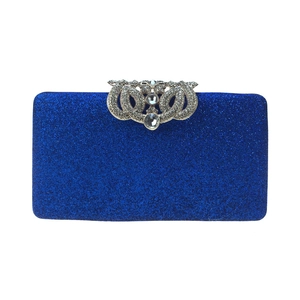 Detailed view of dark blue sequined clutch with silver rhinestone crown clasp
