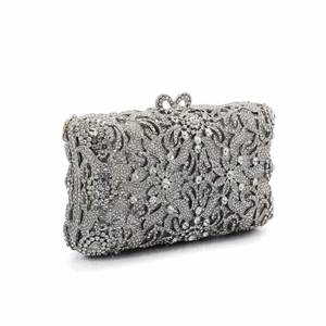 Silver hollow metal clutch bag with sparkling crystal floral rhinestones and bow clasp