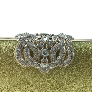 Elegant gold glitter evening clutch bag with ornate crystal encrusted flower clasp