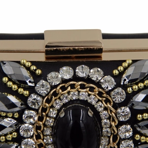 Macro view of exquisite black gemstone and crystals on elegant beaded evening clutch