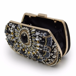 Detail of vintage evening clutch with handmade beadwork, sequins and colorful gemstones
