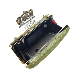 Gold sequin evening clutch bag with crown clasp and spacious interior for essentials