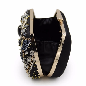 Vintage black beaded evening clutch with rhinestones and gold metal frame detailing