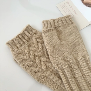Beige cable knit fingerless gloves with ribbed cuffs on a clean white background