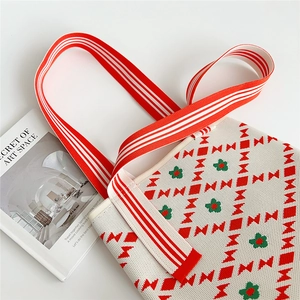 Knitted shoulder tote bag with floral patterns and red striped straps for daily shopping