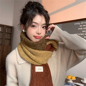 Detail of color-block chunky knit scarf with vintage brown, yellow and green tones