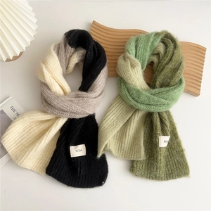 Thick knitted scarves in tricolor patchwork designs with premium brand labels