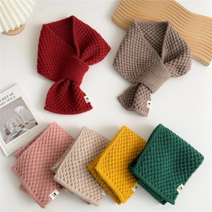 Winter chunky knit criss-cross scarf for women in multiple colors with cat pattern label