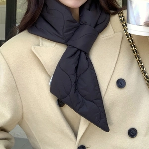 Detail of black quilted down scarf with windproof fabric and gourd-style stitching