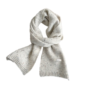 Minimalist long knit 100% wool scarf in cream with colorful flecks for winter warmth