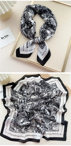 Detail of vintage black and white silk scarf with architectural print and border lettering
