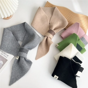 Thick knitted cross scarf for women with H label, available in multiple warm winter colors