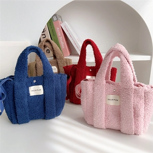 Fuzzy faux fur crossbody bags in royal blue, brown, red, and pink colors displayed together