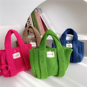 Plush faux fur tote bags in vibrant colors with top handles and shoulder straps