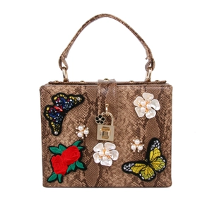 Sac à main vintage à imprimé serpent avec broderie florale et fermoir doré chic