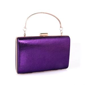 Detail of purple metallic textured evening clutch with gold handle and metal frame