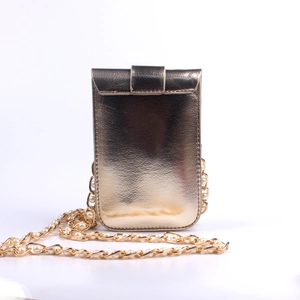 Detailed view of champagne gold crossbody phone bag with elegant pearl chain strap