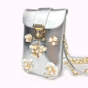 Silver metallic crossbody phone bag with pearl flower decor and gold chain strap
