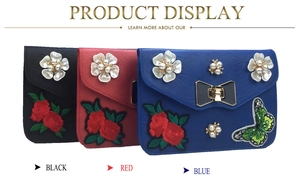 Three elegant crossbody bags in black, red, and blue with pearl flowers and rose embroidery