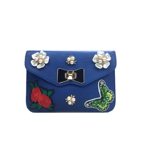 Royal blue faux leather crossbody bag with butterfly embroidery and pearl floral accents