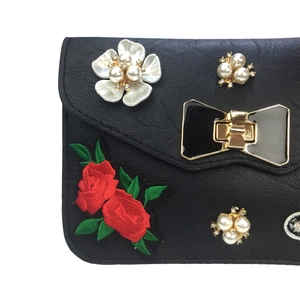 Elegant black crossbody bag with rose embroidery and pearl flowers and butterfly lock