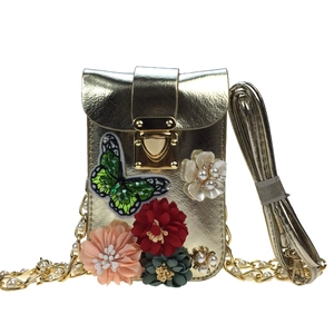 Golden crossbody phone bag with 3D floral embroidery, sequin butterfly, and heart lock