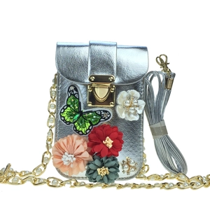 Silver metallic mini crossbody phone bag with floral embroidery and pearl chain strap