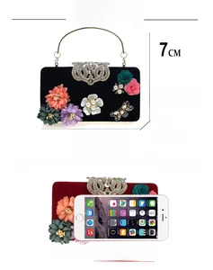 Size comparison and dimensions of velvet evening bag with 3D floral and pearl details