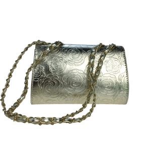 Golden embossed rose evening clutch bag with chain strap and satin floral texture
